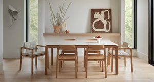 Australian made solid wood dining chairs and dining armchairs around a solid wood dining table in a stunning Australian apartment