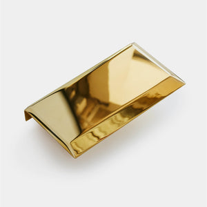 a modern accessory in solid polished brass to suit a modern sofa 
